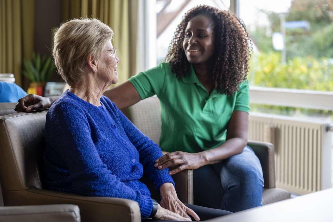 Team Member Providing Support to a Senior Resident - The Preserve A caring team member comforts a resident at The Preserve, a senior living community in Clearwater, Florida